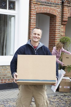 Removal team preparing a Kingston home move with boxes and furniture