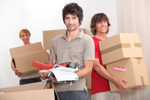 Professional movers navigating a Kingston residential street