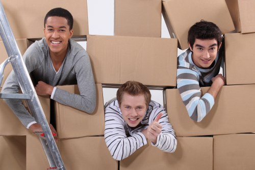 Removal van and team planning a move in Kingston residential street