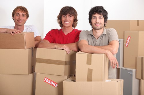 Local moving team handling furniture in a Kingston property