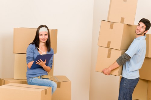 Packed office boxes and furniture ready for relocation in Kingston